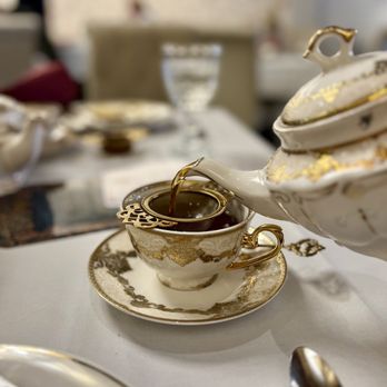 High Tea - a teapot and a teacup on a table - Desserts Near Me - Grand Rapids, Michigan