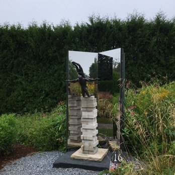 Kingsbrae Garden - a sculpture of a stack of books - Canadian (New) Near Me - Saint Andrews, New Brunswick Kingsbrae Garden - a sculpture of a stack of books - Canadian (New) Near Me - Saint Andrews, New Brunswick