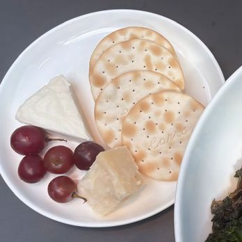 Delta One Lounge - Tasty cheese plate, fruit, and water crackers - Airport Lounges Near Me - Queens, New York