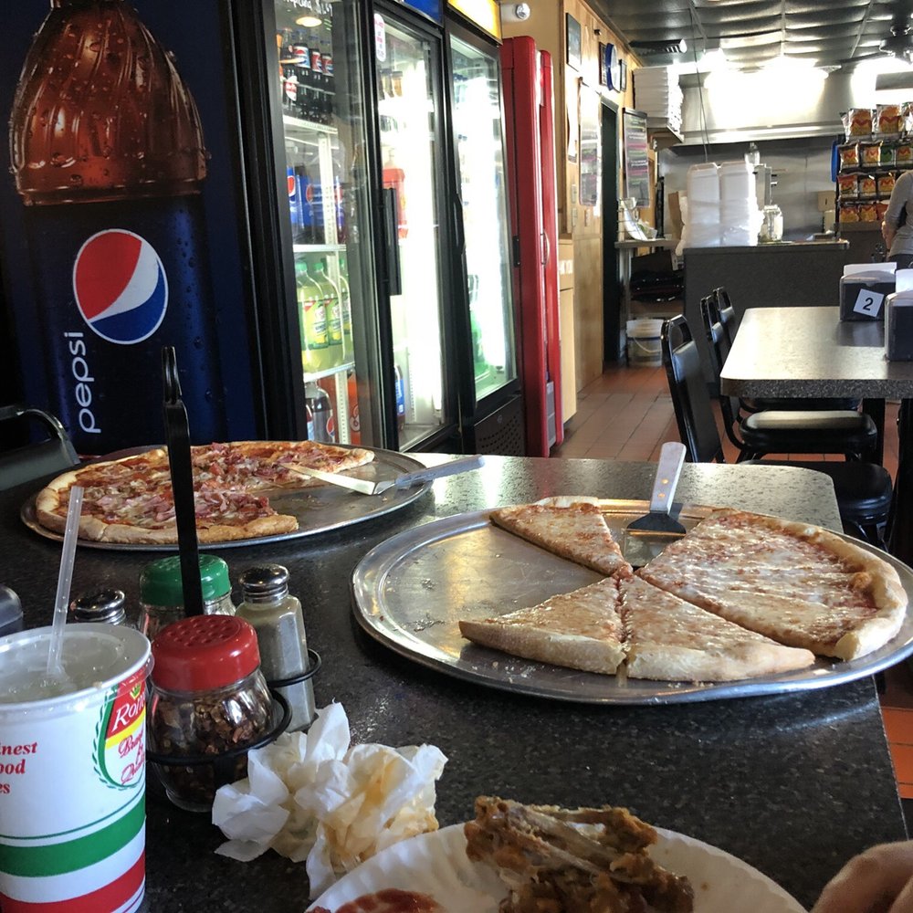 Dauphin Pizza - two pizzas on a table in a restaurant - Pizza Near Me - Dauphin, Pennsylvania Dauphin Pizza - two pizzas on a table in a restaurant - Pizza Near Me - Dauphin, Pennsylvania