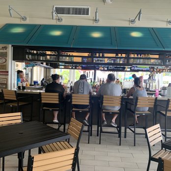 Breezes Restaurant & Bar - The bar and its patrons - New American Near Me - Kissimmee, Florida Breezes Restaurant & Bar - The bar and its patrons - New American Near Me - Kissimmee, Florida