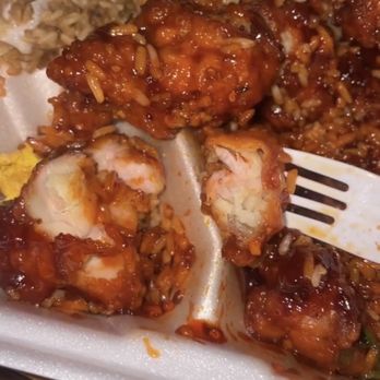 Hunan Express - a plate of chicken and rice with a fork - Chinese Near Me - Corpus Christi, Texas