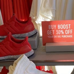 The sign with the shoes I tried to buy next to it.