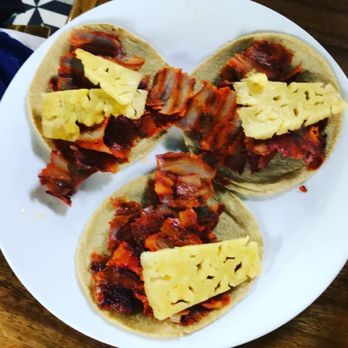 La Tomate - Al pastor tacos topped with pineapple. - Tacos Near Me - Guadalajara, JAL La Tomate - Al pastor tacos topped with pineapple. - Tacos Near Me - Guadalajara, JAL