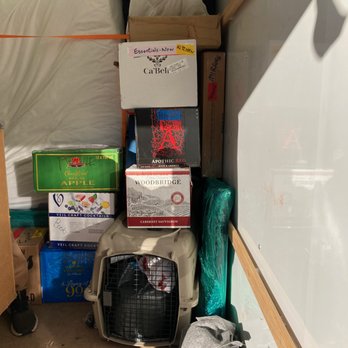 Nicolosi Moving & Storage - Dog crate on bottom nearly crushed & is still bent. - Movers Near Me - Tucson, Arizona Nicolosi Moving & Storage - Dog crate on bottom nearly crushed & is still bent. - Movers Near Me - Tucson, Arizona