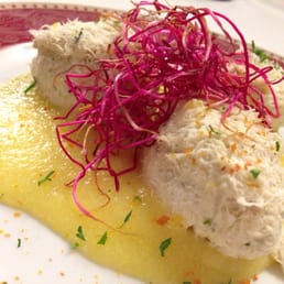 Salted cod over polenta. Served at room temp.  Classic Venetian dish.