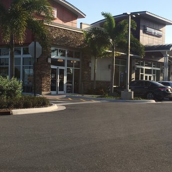 7-Eleven - a car parked in front of a building - Convenience Stores Near Me - West Palm Beach, Florida