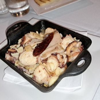 Sancho Restaurant - Fantastic grilled pulpo in a popping bubbling hot garlic sauce.  Delicious! - Spanish Near Me - Miami, Florida