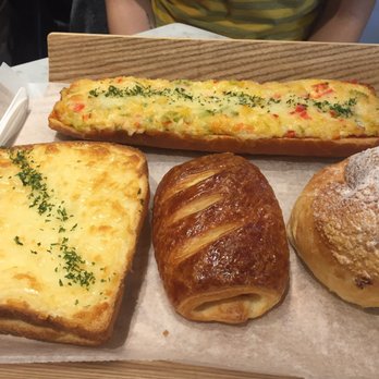 Tous Les Jours - That little round ball like pastry on the bottom right is my absolute favorite!! It's filled with cream but not a thick cream - Bakeries Near Me - Brooklyn, New York
