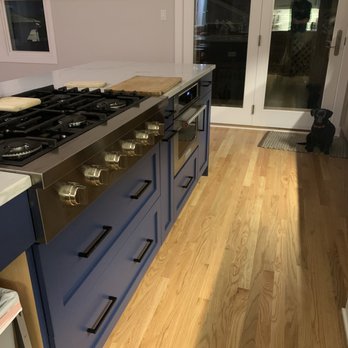 Stratagem Construction - a kitchen with blue cabinets - General Contractors Near Me - Chicago, Illinois