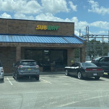 Subway - cars parked in front of a subway subway - Fast Food Near Me - Leland, North Carolina
