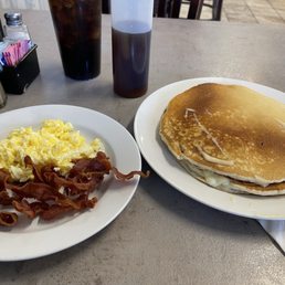 Pancake platter. It comes with 2 eggs fixed how you like, meat of your choice, and two humongous pancakes! I took most of it home!
