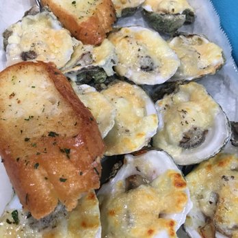 Buckets Crawfish & Seafood - Garlic Parmesan oysters on half shell grilled. - Seafood Near Me - Pineville, Louisiana Buckets Crawfish & Seafood - Garlic Parmesan oysters on half shell grilled. - Seafood Near Me - Pineville, Louisiana