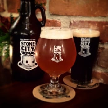 Stone City Ales - a glass of beer next to a growl of beer - Breweries Near Me - Kingston, Ontario