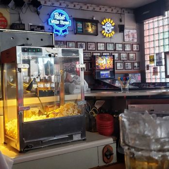 Crystal Corner - a popcorn machine and a glass of beer - Dive Bars Near Me - Madison, Wisconsin