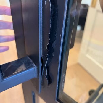 Shane's Panes - Black iron door damaged at the handle - Windows Installation Near Me - Georgetown, Texas Shane's Panes - Black iron door damaged at the handle - Windows Installation Near Me - Georgetown, Texas