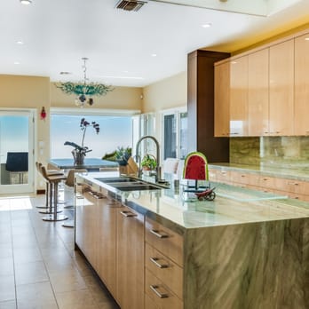 Archer Building Group - a kitchen with marble countertops and stainless steel appliances - General Contractors Near Me - Redondo Beach, California