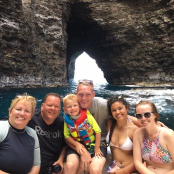 Na Pali Experience - Family shot inside a cave before heading back out. - Boating Near Me - Kekaha, Hawaii Na Pali Experience - Family shot inside a cave before heading back out. - Boating Near Me - Kekaha, Hawaii
