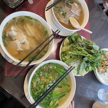 Nam Phuong - Pho (chicken left, beef right), Noodle Soup with chicken, platter of fresh additions and veggies to add to the soups - Vietnamese Near Me - Atlanta, Georgia Nam Phuong - Pho (chicken left, beef right), Noodle Soup with chicken, platter of fresh additions and veggies to add to the soups - Vietnamese Near Me - Atlanta, Georgia