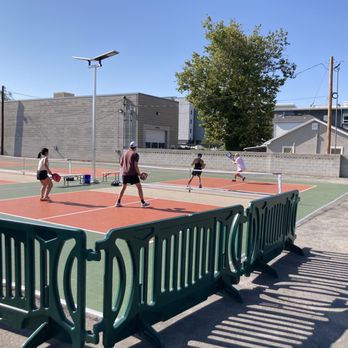 Second Summit Hard Cider - a group of people playing tennis - Cideries Near Me - Millcreek, Utah