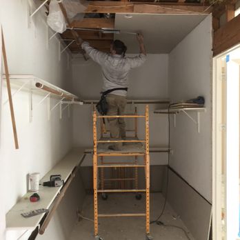 Global Makeready - Employees working remodeling closet - Roofing Near Me Global Makeready - Employees working remodeling closet - Roofing Near Me