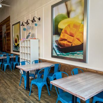 Tropical Smoothie Cafe - tables and blue chairs - Juice Bars & Smoothies Near Me - Austin, Texas Tropical Smoothie Cafe - tables and blue chairs - Juice Bars & Smoothies Near Me - Austin, Texas