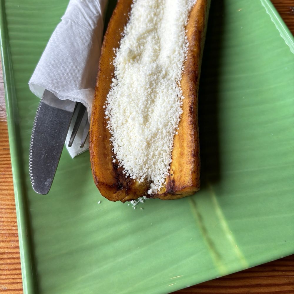 a slice of banana bread on a green plate a slice of banana bread on a green plate