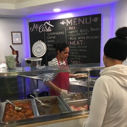Owner Kuri serving authentic Dominican Food!