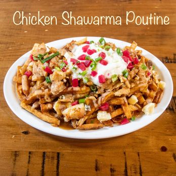 Maham & Pop's Donair Poutine - a plate of food on a wooden table - Poutineries Near Me - Victoria, British Columbia Maham & Pop's Donair Poutine - a plate of food on a wooden table - Poutineries Near Me - Victoria, British Columbia