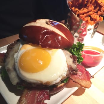 Root Down DIA - Half pound burger with bacon, added egg on pretzel bun - New American Near Me - Denver, Colorado