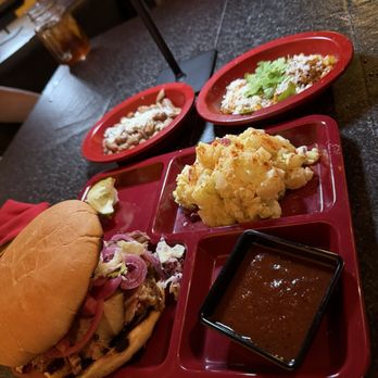 Rock N Raul's Smokehouse - Sliced brisket sandwich, potato salad, beans and elote - Barbeque Near Me - Fort Davis, Texas
