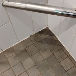 Dirty shower grout in bathroom Dirty shower grout in bathroom