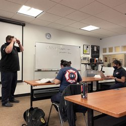 Jayson Nickle tutors students after class