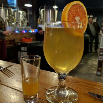 Bog Brewing Company - The first course Berliner Weisse with Blood Orange syrup, and a slice - Breweries Near Me - Saint Augustine, Florida Bog Brewing Company - The first course Berliner Weisse with Blood Orange syrup, and a slice - Breweries Near Me - Saint Augustine, Florida