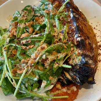 Safta - Charred Cabbage atop Muhammara and some greens - Middle Eastern Near Me - Denver, Colorado Safta - Charred Cabbage atop Muhammara and some greens - Middle Eastern Near Me - Denver, Colorado