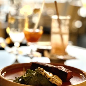 The Loft - a plate of food on a table - New American Near Me - Laguna Beach, California