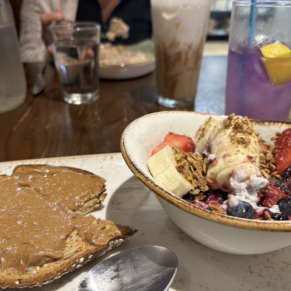 First Watch - Power bowl coconut chia pudding with seasonal fruit and granola on top. Toast with almond butta and flakey sea salt . - Breakfast & Brunch Near Me - Des Plaines, Illinois