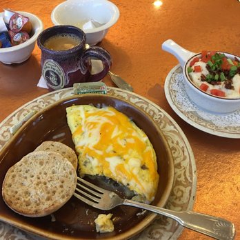Another Broken Egg Cafe - The Supreme Omelet with sausage, bacon, sautéed onions & mushrooms with Cheddar-Jack. Along with a side of City Grits and a cup of coffee. - Breakfast & Brunch Near Me - Pensacola, Florida Another Broken Egg Cafe - The Supreme Omelet with sausage, bacon, sautéed onions & mushrooms with Cheddar-Jack. Along with a side of City Grits and a cup of coffee. - Breakfast & Brunch Near Me - Pensacola, Florida