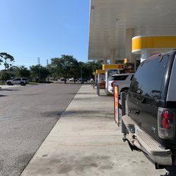 Shell Gas Station - Others agree it's good to get gas here. Every pump has a car.