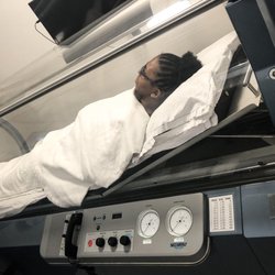 Hyperbaric Centers of Chicago - Our medical receptionist demonstrating our Mono Chamber.