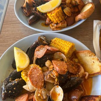 Surfside Fish House - Top: The Seafood Boil Flavor: Louisiana Cajun Bottom: The Seafood Boil Flavor: Garlic Butter - Seafood Near Me - San Diego, California Surfside Fish House - Top: The Seafood Boil Flavor: Louisiana Cajun Bottom: The Seafood Boil Flavor: Garlic Butter - Seafood Near Me - San Diego, California