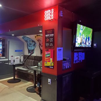 The Den - a man standing in front of a television - Arcades Near Me - Vancouver, British Columbia