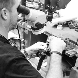 Piper Diamond - Travis Piper setting a diamond in a ring at Piper Diamond Co.