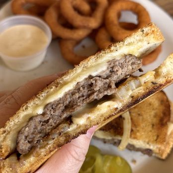 Flippy's Cafe - Patty Melt!! 1/4 lb burger on toasted rye with Swiss cheese and grilled onion! So good today! With onion rings! - Diners Near Me - Rodeo, California