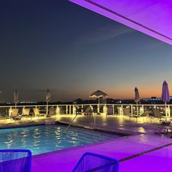 The Reef Rooftop Lounge - Pool area with sunset view