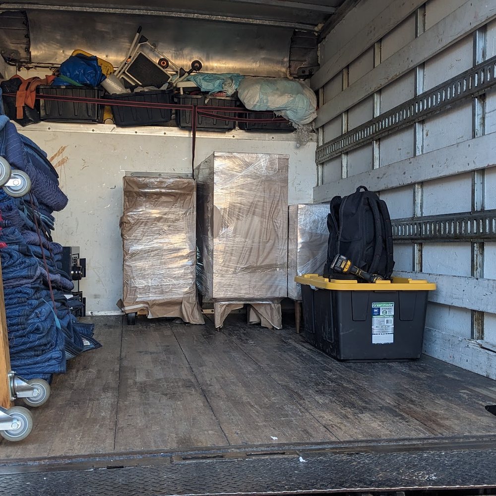 Clear Out Enterprises - Marcos carefully packed two pieces of furniture in his truck. - Movers Near Me