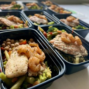 Keyvin's Kitchen - Tilapia & shrimp on a bed of steamed broccoli medley with sautéed garbanzo beans. - Food Delivery Services Near Me Keyvin's Kitchen - Tilapia & shrimp on a bed of steamed broccoli medley with sautéed garbanzo beans. - Food Delivery Services Near Me