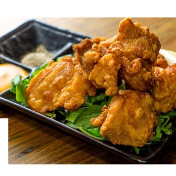 Kuu - a plate of fried chicken with a side of dipping sauce - Ramen Near Me - New York, New York
