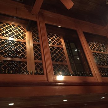 Restaurant August - Wines above dining room in temperature controlled celllar - New American Near Me - New Orleans, Louisiana
