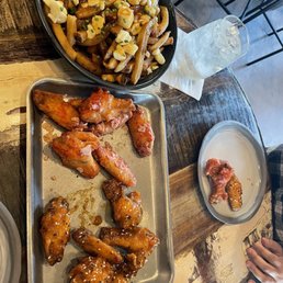 Classic poutine and sweet and sour wings with ketchup wings. Really good.